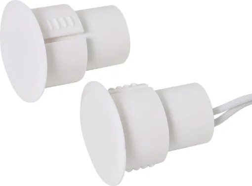 A concealed magnetic reed switch designed for use with metal door frames.